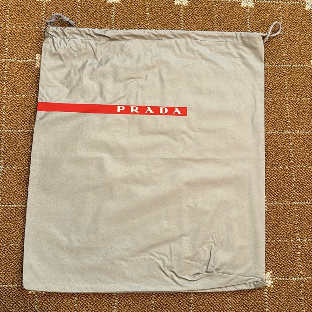NWOT💕Authentic Prada drawstring bag,  silver grey with Prada red and white logo